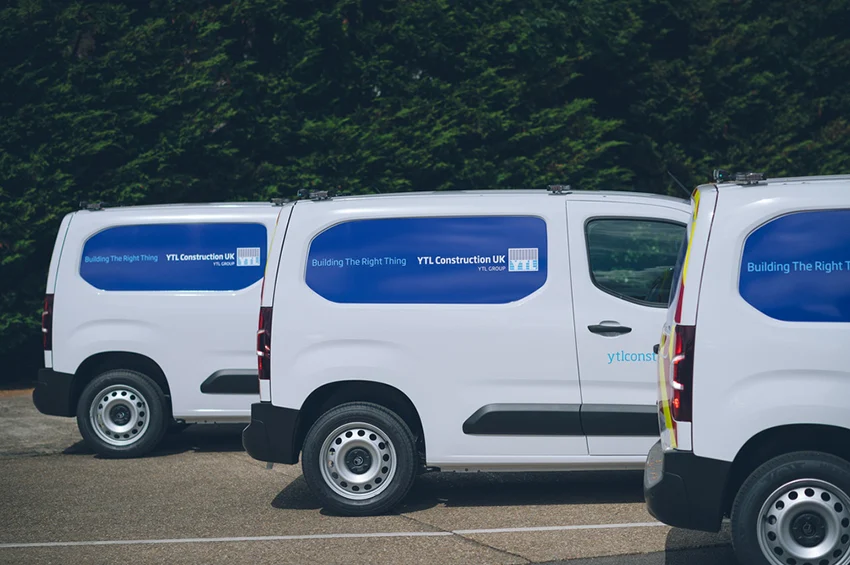 Company vehicles parked in a row